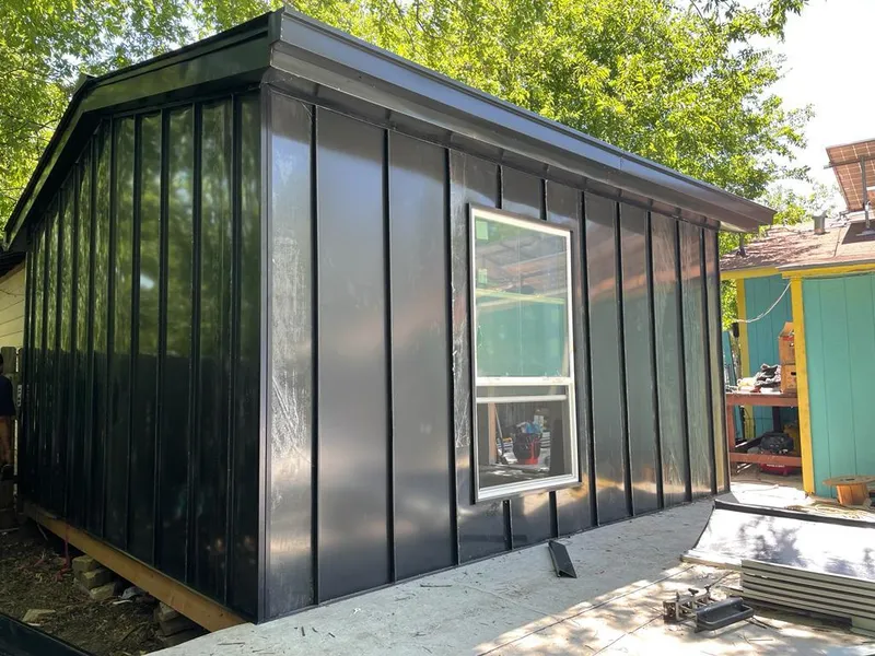 Black standing seam metal wall panels for Roof Inspection in Miles City